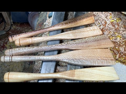 Richard Raffan turns a run of five spatulas.