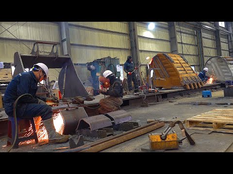 Process of Making a Steel Volvo Excavator Bucket. Heavy Equipment Factory in Korea.