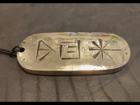 Bronze cuneiform pendants