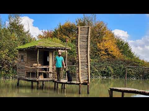 Bushcraft building and living with a dog above a lake in the wild!