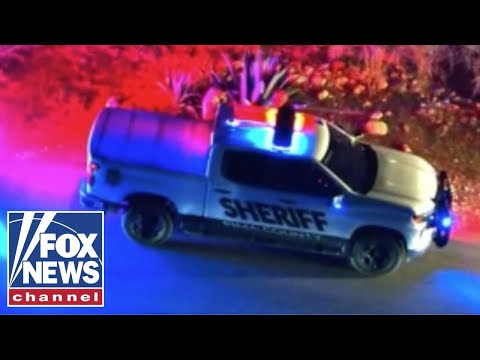 Investigators seen leaving Guthrie home with white case, brown bag