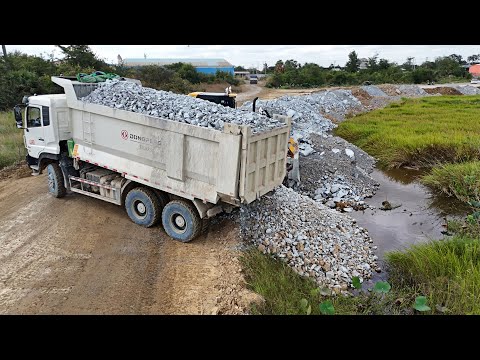 Excellent new job !! 10-wheel truck use stone fill huge region & push by Powerful dozer