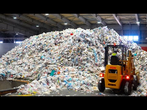 Japanese Plastic recycling process. A recycling factory produces 450,000 recycled pallets per year.