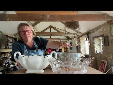 Making big arrangements to help dress a house for tv cameras