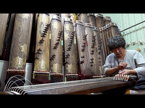 Process of making zither. Korean traditional musical string instruments factory