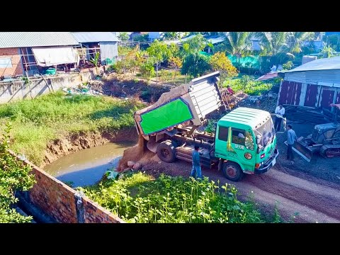 Start Opening New Project!! KOMAT'SU BLACK Dozer DA2P pushing Soil into flooded​ Pond& 5Ton Trucks.