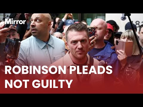 Tommy Robinson arrives at court charged with harassment