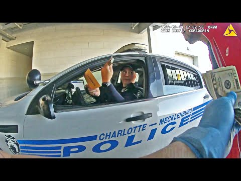 Charlotte Cop Caught on Camera Stealing Cash From a Detainee