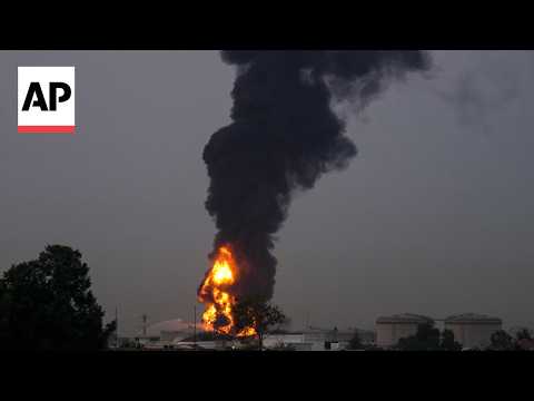 Black smoke over Dubai airport after Iran drone strike hits fuel tank