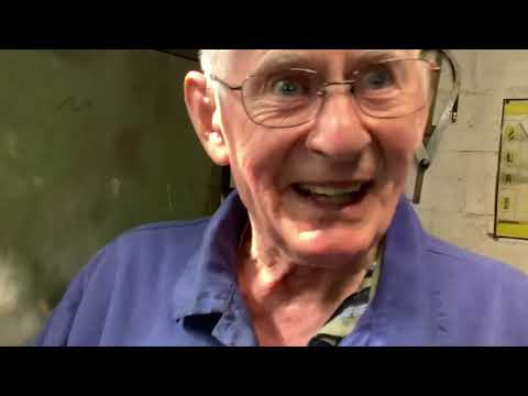 Hand-scraping a white metal steam gland.