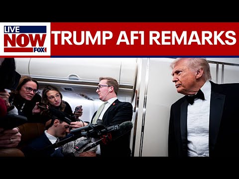 President Trump speaks to reporters aboard AF1