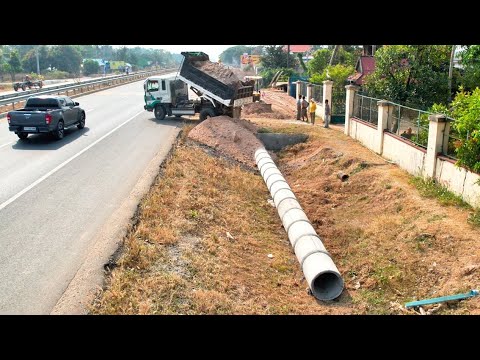 Dropping soil bury drainage system next to the road. Drivers passing by must be very careful.