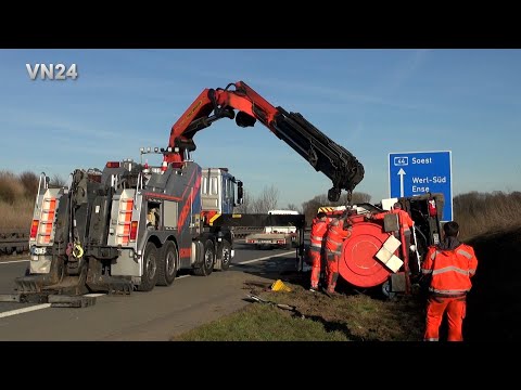 VN24 - Special suction tanker truck tips onto its side in the ditch on the A44