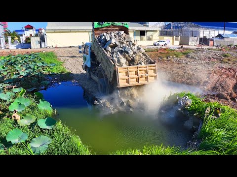 Unbelievable for construction of​ road across lake,5-ton trucks carry, bulldozer crushing the stones