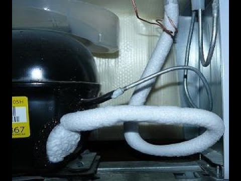 What to do if the tube freezes at the back near the motor in the refrigerator
