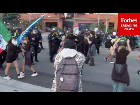 Fireworks Are Thrown During Standoff Between Anti-ICE Demonstrators And LAPD Officers In Los Angeles