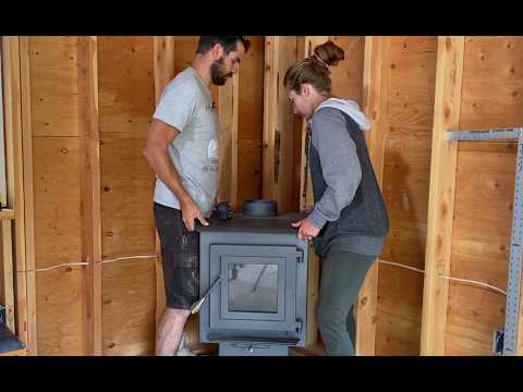 There's a HOLE in our ROOF! | Wood Stove Installation for Off Grid Cabin | Chimney Rough-In
