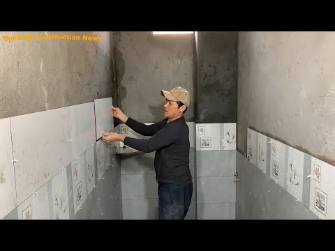 Professional Bathroom Wall Construction Workers Use Patterned Ceramic Tiles Measuring 30 x 60cm