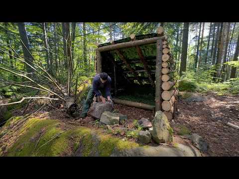 Building a warm shelter for survival in the forest, solo bushcraft camping in the wild