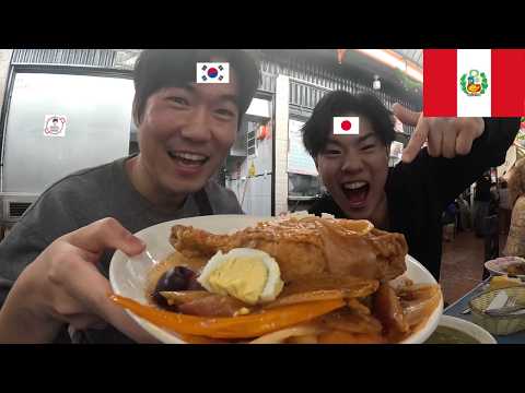 Korean and Japanese trying Peruvian food at the 100% local market