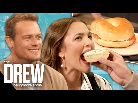 Sam Heughan Feeds Drew as She Helps Him Find the Best Bagel in NYC