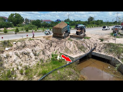 Amazing skill technique bulldozer operator filling land greatly with dump trucks