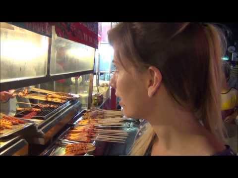 Tour of Yangshuo night life visiting a night market and eating Chinese street food (阳朔夜市和街头食品) China