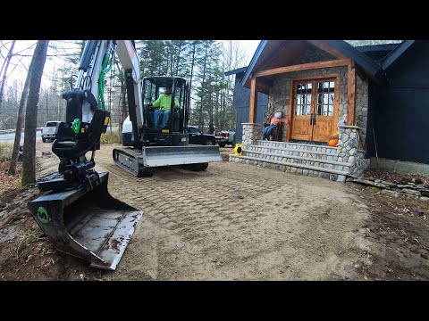 Spreading Driveway Base and Building a Rock Wall with a Tilt Rotator