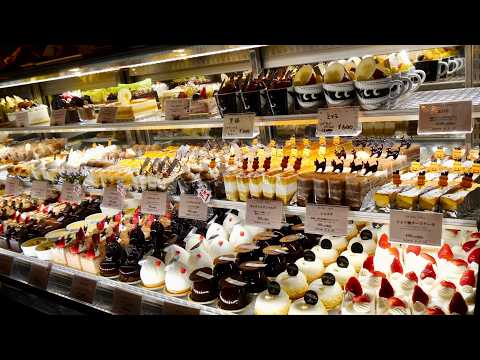 Beautiful Cakes in a Packed ShowcaseInside a Popular Bakery