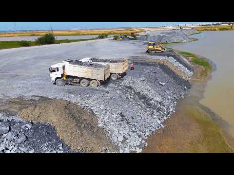 Start working on new projects and push a dump truck with a wheel loader and unload a 25-ton truck.