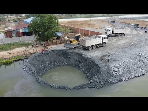 Shantui Bulldozer And Many Dump Trucks Working Repair The Land With Mines Stones
