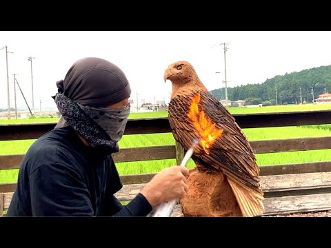 Bald Eagle resting its wings on the rock-Wood chainsaw carving