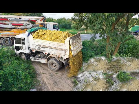 Be Carefully Started ANew Project!Dumping Truck Pour landNear Sideroad,Expert Bulldozer Pushing Soil