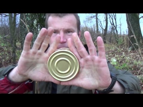 Opening a flat tin can with bare hands