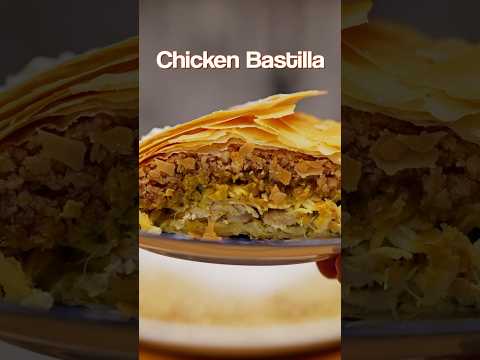 Moroccan Chicken Bastilla 🇲🇦 – Flaky pastry, spiced chicken, and a surprise sweet topping!