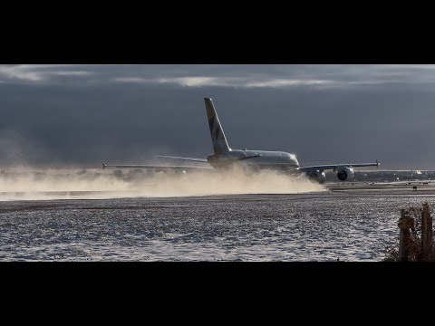 A380 Full Thrust Takeoff Blowing Snow Into the Air