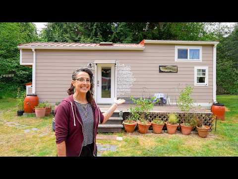 The inside of her tiny home feels huge! Folding staircase & luxury bathtub