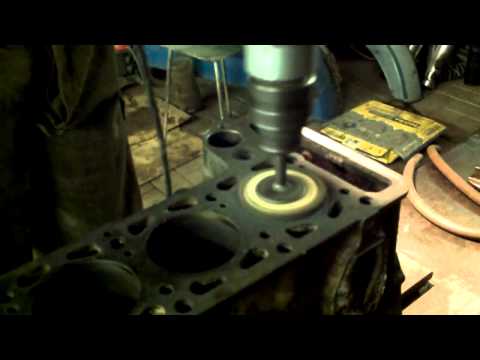 Polishing the cylinder to a mirror finish after boring.