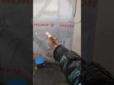 Preparation for installation of underfloor heating screed and wall on a wooden base in a bathhous...