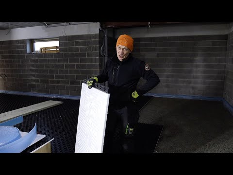 Stages of installation of heated floors. Laying the heat-insulating layer.