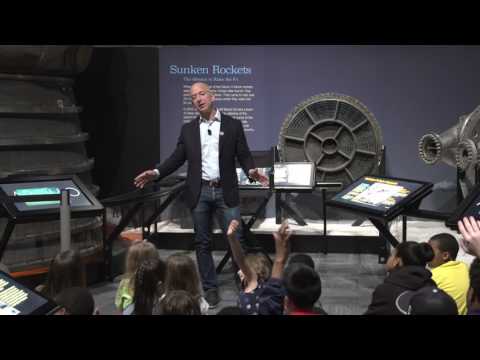 Jeff Bezos speaks with students at the opening of the Apollo exhibit at The Museum of Flight