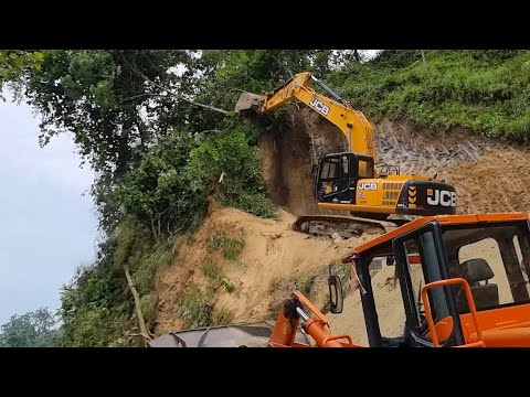 Tearing Down Hill Top Side for Road Construction with JCB Excavator