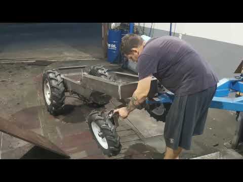 Installing a steering gearbox and steering rods, adjusting the rocker arm on a mini tractor