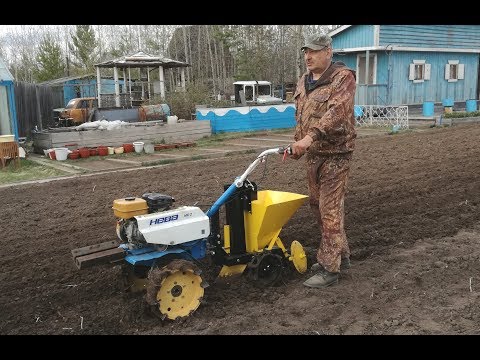 Planting potatoes with potato planter COP 01 virgin Soil