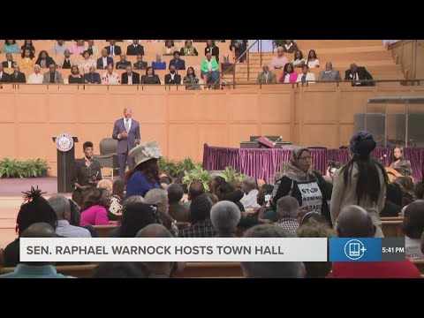 Commotion breaks out during Sen. Warnock's town hall