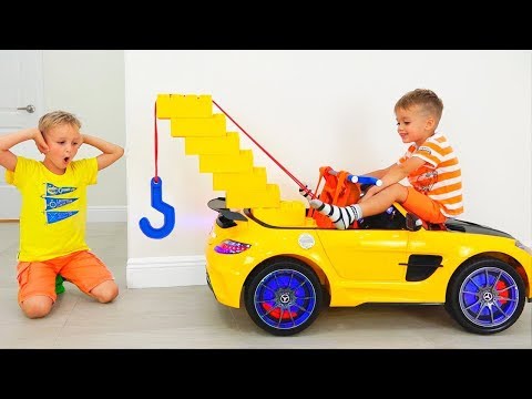 Vlad y Nikita juegan con Toy Tow Truck para niños