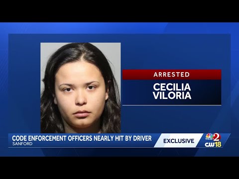 Police: Woman nearly ran over Sanford code enforcement officers after parking ticket