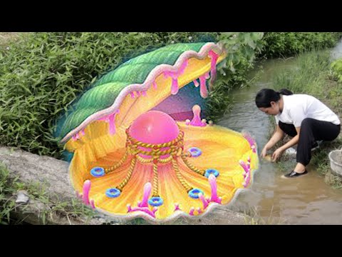 Natural pearls of Pearl Kingdom: A girl tripped over a giant river clam filled with precious stones