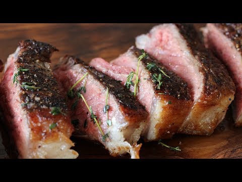 NY Strip Steak With Garlic Thyme Butter Cooked In Cast Iron Skillet!
