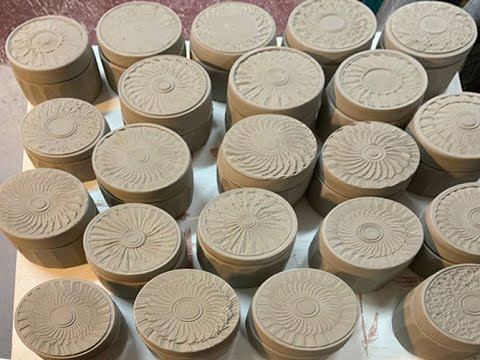 Making clay boxes with textured chattering.